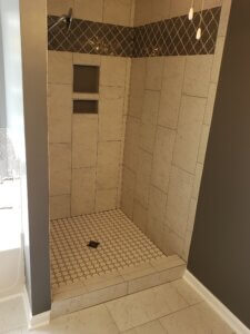Tile shower with custom niches built into the wall