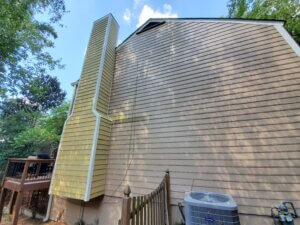 Chimney that has been repaired with new wood from top to bottom